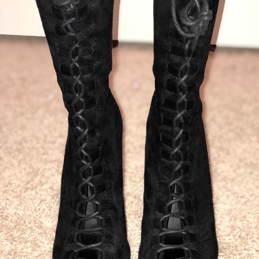 Black tie up heeled boot.